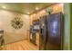 Kitchen with black appliances and granite countertops, offering modern convenience and style at 275 S Harrison St # 409, Denver, CO 80209