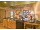 Kitchen view from island with granite countertops showcasing open layout to the living room and balcony at 275 S Harrison St # 409, Denver, CO 80209