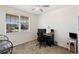 Bedroom with a ceiling fan, large window, and a desk setup, perfect for a home office at 1799 Jade Ave, Brighton, CO 80603