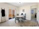 Bright dining area featuring neutral paint, a sliding glass door, and comfortable table with seating at 1799 Jade Ave, Brighton, CO 80603