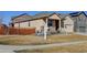 Attractive single-story home showcasing siding, stone accents, and an attached two-car garage at 1799 Jade Ave, Brighton, CO 80603