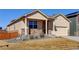 Charming single-story home with a welcoming front porch and neutral siding at 1799 Jade Ave, Brighton, CO 80603