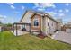 Backyard features a patio with pergola, lawn area, and neutral-colored siding at 15524 E 115Th Ave, Commerce City, CO 80022