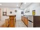 Finished basement bar features wooden cabinetry, sink, and mini fridge at 15524 E 115Th Ave, Commerce City, CO 80022