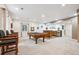 Spacious finished basement with a full bar and pool table, great for entertaining guests at 15524 E 115Th Ave, Commerce City, CO 80022