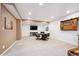 Finished basement including a seating area and entertainment space at 15524 E 115Th Ave, Commerce City, CO 80022