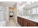 Elegant bathroom featuring double vanity, quartz countertops and a glass shower at 15524 E 115Th Ave, Commerce City, CO 80022