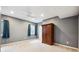 Basement bedroom features an oversized wardrobe and two windows for natural light at 15524 E 115Th Ave, Commerce City, CO 80022