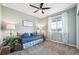 Cozy bedroom with natural light, ceiling fan, and blue accents at 15524 E 115Th Ave, Commerce City, CO 80022