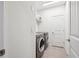 Laundry room featuring a washer, dryer, and white walls at 15524 E 115Th Ave, Commerce City, CO 80022
