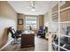 Home office with wood-look tile flooring, large window, and french doors at 15524 E 115Th Ave, Commerce City, CO 80022