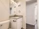 Modern bathroom featuring a vanity, updated fixtures and bright lighting at 1926 S Yates St, Denver, CO 80219