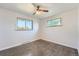 Cozy bedroom with hardwood floors and dual windows providing ample natural light at 1926 S Yates St, Denver, CO 80219