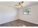 Bright bedroom with hardwood floors, a ceiling fan, and a window offering natural light at 1926 S Yates St, Denver, CO 80219