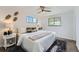 Cozy bedroom with soft lighting, a ceiling fan, and comfortable furnishings at 1926 S Yates St, Denver, CO 80219