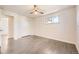 Comfortable bedroom with ceiling fan, wood-look floors and a closet at 1926 S Yates St, Denver, CO 80219