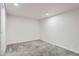 Clean bedroom with neutral carpet, ample lighting, and freshly painted white walls at 1926 S Yates St, Denver, CO 80219