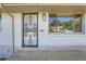 Charming home featuring a secure wrought iron door and beautiful white brick exterior at 1926 S Yates St, Denver, CO 80219