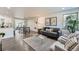 Bright living room with hardwood floors, stylish furniture, and an open concept design at 1926 S Yates St, Denver, CO 80219