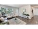 Open living space with cozy seating, modern decor, and plenty of natural light at 1926 S Yates St, Denver, CO 80219