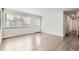 Bright living room featuring hardwood floors, white walls and modern trim at 1926 S Yates St, Denver, CO 80219