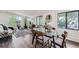Bright living room featuring a glass table, modern decor, and hardwood floors at 1926 S Yates St, Denver, CO 80219