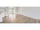 Bright sun room featuring hardwood floors, white walls and modern trim at 1926 S Yates St, Denver, CO 80219