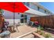 Enclosed backyard with a BBQ grill, AC condenser, wood fence, patio, sliding doors and planter at 13977 E Bails Pl, Aurora, CO 80012
