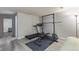 Finished basement with an exercise area, gray walls and gray wood-look floors at 13977 E Bails Pl, Aurora, CO 80012
