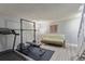 Finished basement featuring an exercise area and gray walls with gray wood-look floors at 13977 E Bails Pl, Aurora, CO 80012