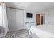 Light-filled bedroom features a large closet and light wood floors at 13977 E Bails Pl, Aurora, CO 80012