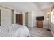 Neutral bedroom with light wood floors, large closet, and a comfortable bed at 13977 E Bails Pl, Aurora, CO 80012