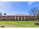 Row of brick townhouses with well-manicured lawns and similar architectural features at 13977 E Bails Pl, Aurora, CO 80012
