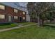 Charming two-story brick townhomes with well-maintained lawns and mature shade trees at 13977 E Bails Pl, Aurora, CO 80012