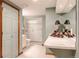 Well-lit bathroom with a glass shower, vanity, and linen closet at 3 Pinyon Pine Rd, Littleton, CO 80127