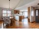 The open-concept dining room flows seamlessly into the modern kitchen, perfect for Gathering gatherings at 3 Pinyon Pine Rd, Littleton, CO 80127