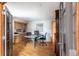Bright home office featuring a marble-top desk, custom built-ins, and glass French doors providing a professional workspace at 3 Pinyon Pine Rd, Littleton, CO 80127