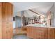 Modern eat-in kitchen with wood cabinets, white countertops and stainless steel appliances at 3 Pinyon Pine Rd, Littleton, CO 80127