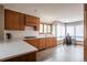 This modern kitchen showcases wood cabinetry, stainless steel appliances, and a cozy breakfast nook at 3 Pinyon Pine Rd, Littleton, CO 80127