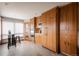 A modern kitchen is equipped with stainless steel appliances, wood cabinets, and a breakfast nook by the window at 3 Pinyon Pine Rd, Littleton, CO 80127