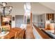 Open-concept living space showcasing the dining area, stairway, and access to office at 3 Pinyon Pine Rd, Littleton, CO 80127
