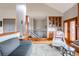 Living room featuring a staircase, custom built-in bar, and comfortable seating at 3 Pinyon Pine Rd, Littleton, CO 80127
