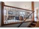 View from the staircase of an inviting living area with neutral tones and plenty of natural light creating a comfortable retreat at 3 Pinyon Pine Rd, Littleton, CO 80127