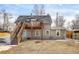 Exterior showcasing a back deck with a wooden staircase and neutral siding at 2565 Pierce St, Lakewood, CO 80214