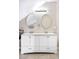 Bathroom features double vanity with oval mirrors and modern lighting fixtures at 2565 Pierce St, Lakewood, CO 80214