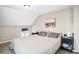 Bedroom featuring neutral-colored walls, two side tables, and a window at 2565 Pierce St, Lakewood, CO 80214