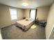 Bright bedroom with neutral tones, a cozy bed, and two side tables at 2565 Pierce St, Lakewood, CO 80214