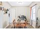 Cozy dining area featuring a glass table with seating for four and modern decor at 2565 Pierce St, Lakewood, CO 80214