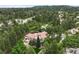 Majestic home surrounded by lush greenery with a terracotta roof, offering scenic hilltop views at 392 Starmine Pl, Castle Rock, CO 80108