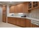 Elegant bar area featuring custom cabinetry, tile backsplash, and ample counter space at 392 Starmine Pl, Castle Rock, CO 80108